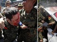 South Koreans burn Japanese flag in protest at mayor's defence of using their women as 'sex slaves' for army during WWII