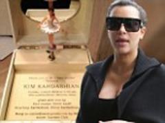 Kim Kardashian's baby shower invite... a ballerina music box complete with Kanye West lullaby