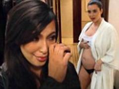Kim Kardashian reveals her bare bump as she moans 'How the f*** did I get like this?' in new trailer