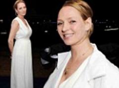 Uma Thurman beams in a bright white jumpsuit as she yacht party hops at Cannes Film Festival