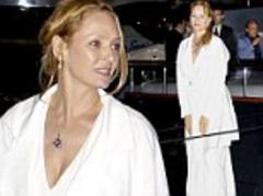 Uma Thurman wears a dressing gown as she party hops between yachts at Cannes Film Festival