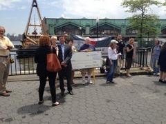 protestors object to funding to pearson publishing